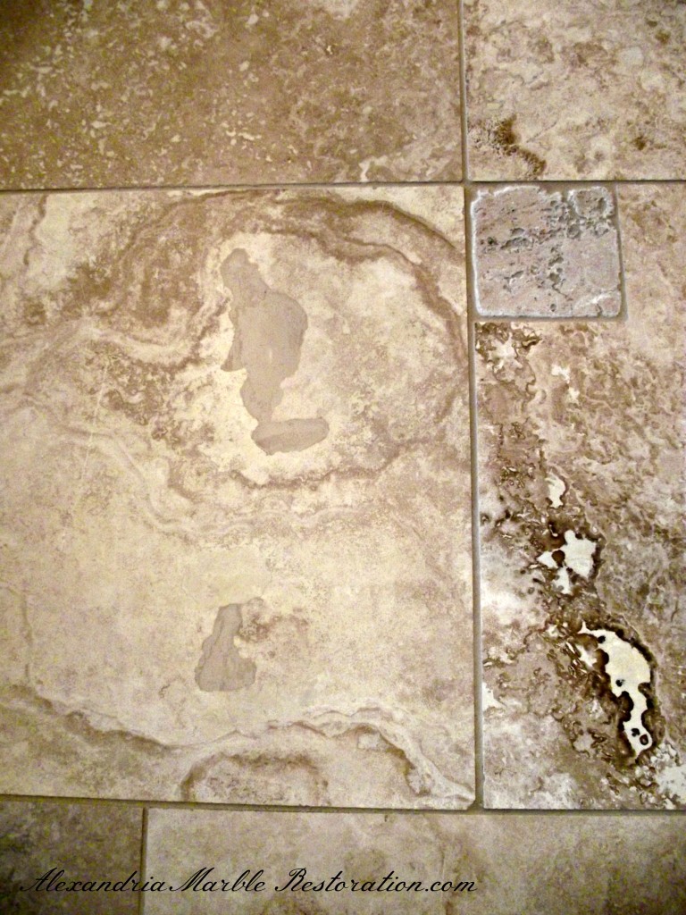 Travertine tile flooring with repaired factory filler