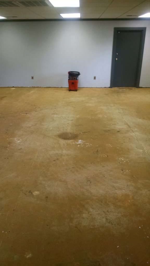 Concrete floor with thick layer of mastic