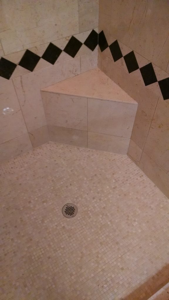 Marble shower after removal of soap and mineral build-up