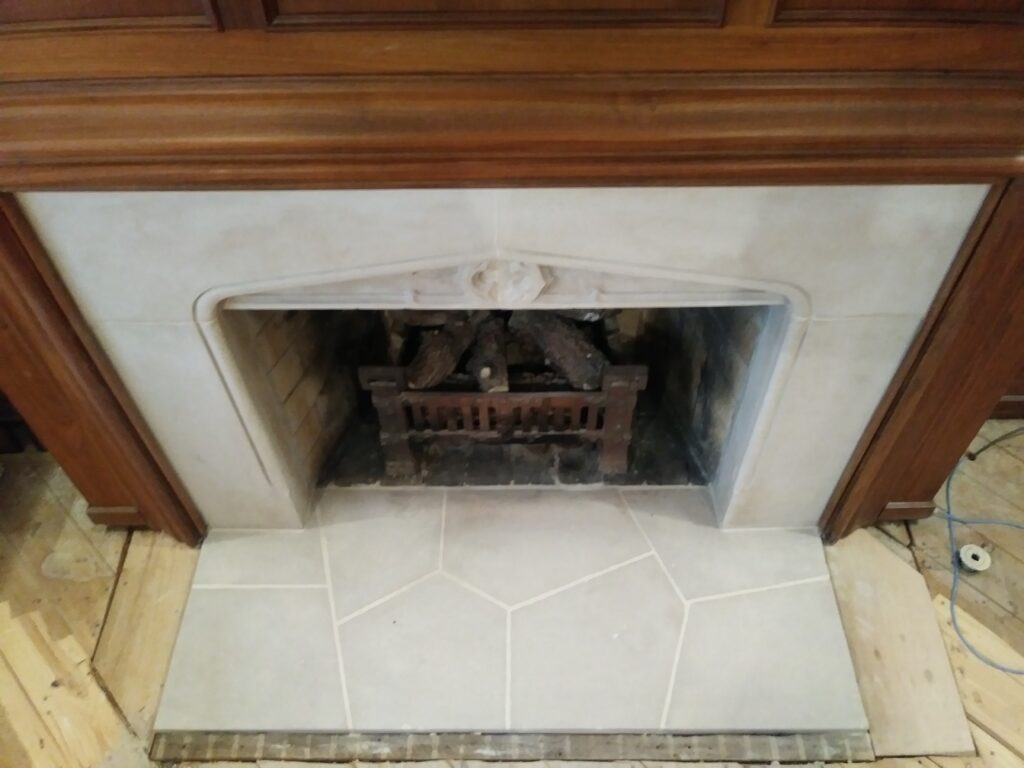 100 year old limestone fireplace after restoration