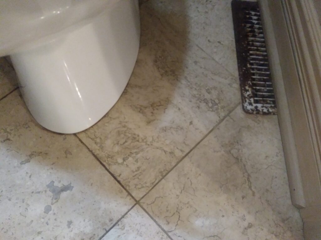 Honed marble tile flooring with heavy soil absorption in tile and grout